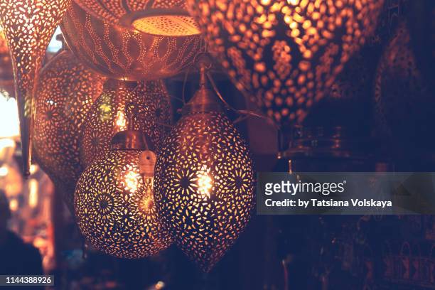 metal lamps in souk, marrakech, morocco - moroccan culture stock pictures, royalty-free photos & images