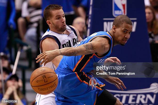 Eric Maynor of the Oklahoma City Thunder goes after the ball as he is guarded by Jose Juan Barea of the Dallas Mavericks in the fourth quarter in...