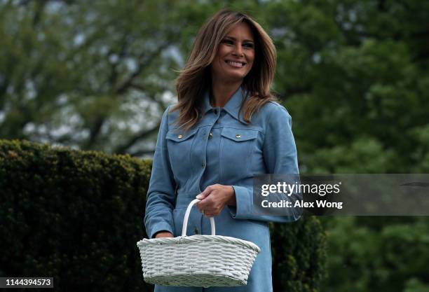 First lady Melania Trump watches children participating in the 141st Easter Egg Roll on the South Lawn of the White House April 22, 2019 in...