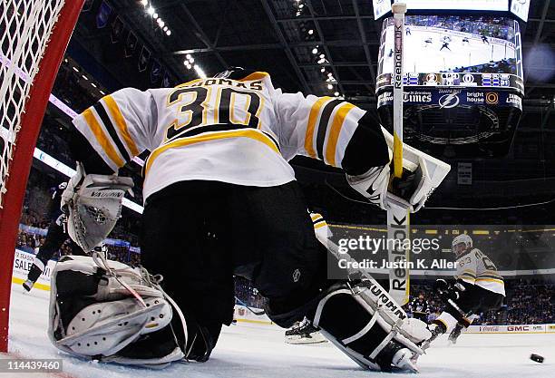 Tim Thomas of the Boston Bruins makes a save against the Tampa Bay Lightning in Game Three of the Eastern Conference Finals during the 2011 NHL...