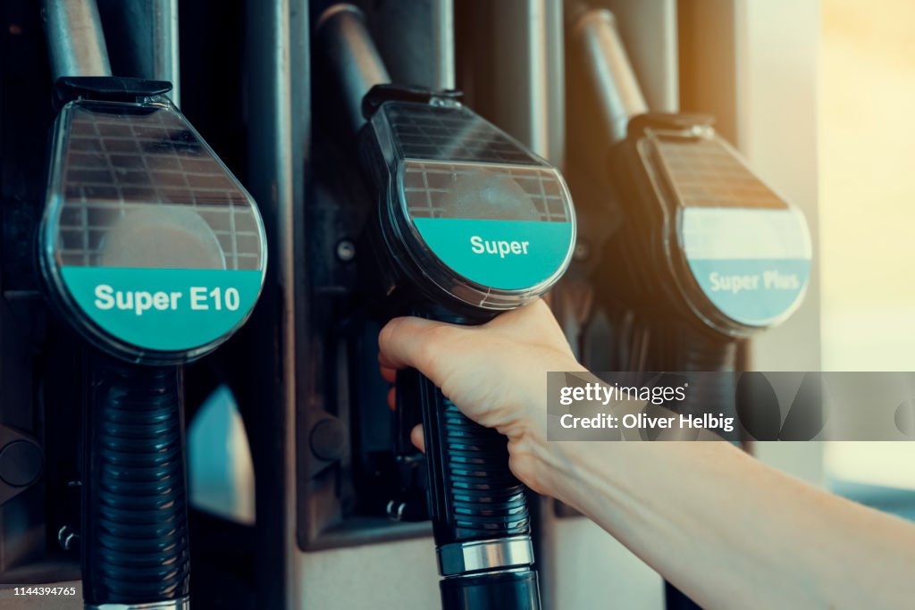 One person uses a fuel pump
