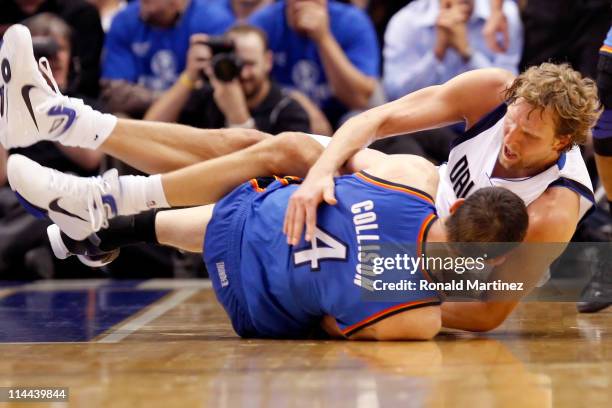 Dirk Nowitzki of the Dallas Mavericks and Nick Collison of the Oklahoma City Thunder battle for a ball on the floor in the fourth quarter in Game Two...