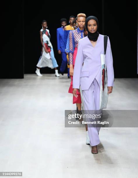 Model walks the runway wearing MmusoMaxellL during Arise Fashion Week on April 21, 2019 in Lagos, Nigeria.