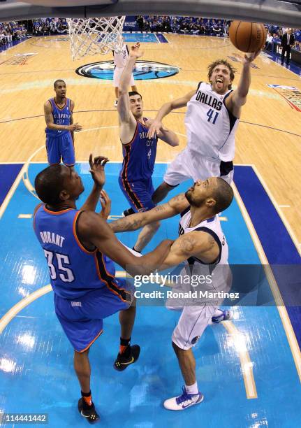Dirk Nowitzki of the Dallas Mavericks goes up for a shot against Nick Collison of the Oklahoma City Thunder in the second half in Game Two of the...