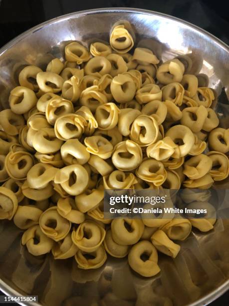 raw dry tortellini - tortellini stock pictures, royalty-free photos & images