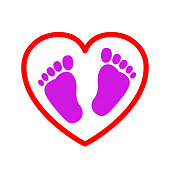 Baby footprints in heart icon - vector