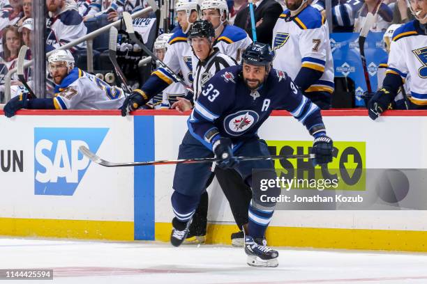 Dustin Byfuglien of the Winnipeg Jets follows the play down the ice during first period action against the St. Louis Blues in Game Five of the...