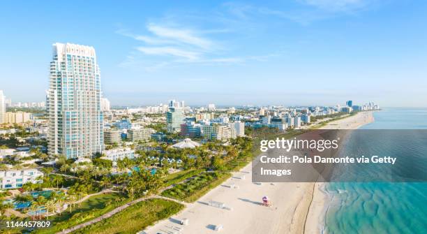 high drone view of south beach in miami from south pointe park, florida, usa - miami beach south pointe park foto e immagini stock