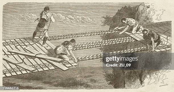 construction of a suspension bridge in japan, published in 1872 - hanging bridge stock illustrations