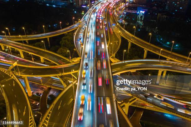 aerial top view of complicated multiple lane highway with traffic in day time - multiple lane highway foto e immagini stock