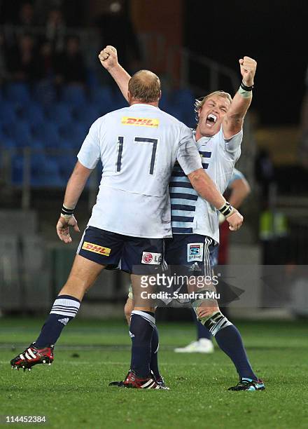 Schalk Burger of the Stormers celebrates with team mate Steven Kitshoff after winning the round 14 Super Rugby match between the Blues and the...