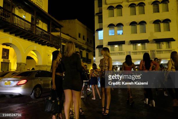Of INDIAS, COLOMBIA Prostitutes wait for foreign tourists in Puerta del Reloj next to the main gateway to the inner walled town at night on February...
