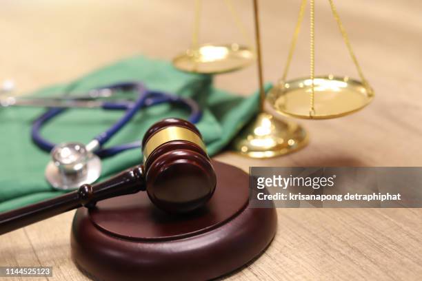 medical law concept,medical law - medical judge stock-fotos und bilder