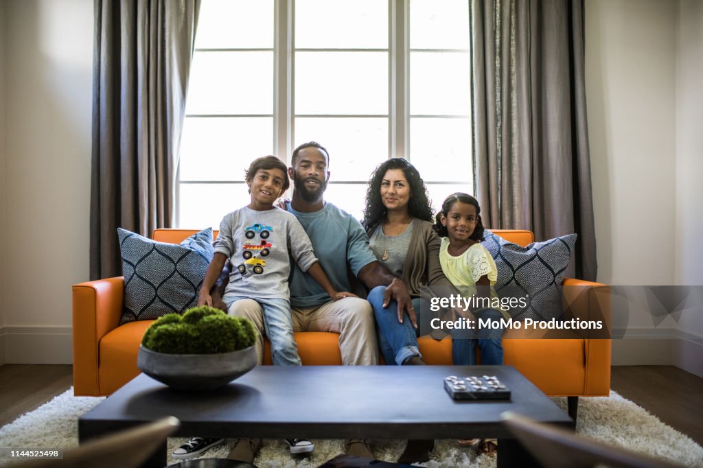 Portrait of family in living room