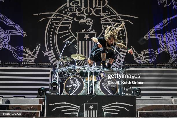 Randy Blythe takes flight as Chris Adler performs on drums for Lamb of God at Ruoff Home Mortgage Music Center on May 16, 2019 in Noblesville,...