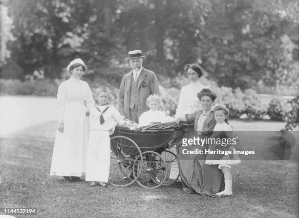 Family portrait, Apsley Paddox, Woodstock Road, Oxford, Oxfordshire, 1913. Charles Robertson and his family posing for a photograph in the garden of...