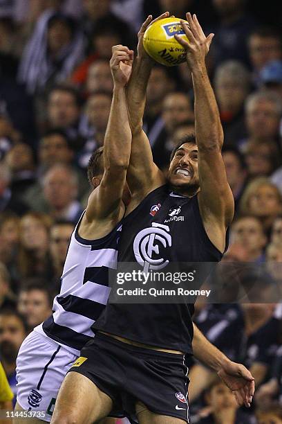 Jarrad Waite of the Blues marks infront of Darren Milburn of the Cats during the round nine AFL match between the Carlton Blues and the Geelong Cats...