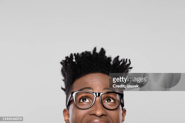 half face of funky young man - looking up stock pictures, royalty-free photos & images