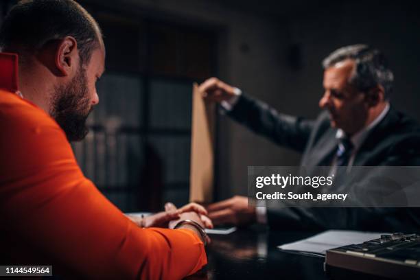 detective and prisoner in interrogation room - probation stock pictures, royalty-free photos & images