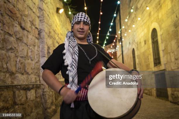 Palestinian volunteers trying to continue Ramadan drum tradition in despite of Israeli polices' pressure, walk streets with drums to wake people for...