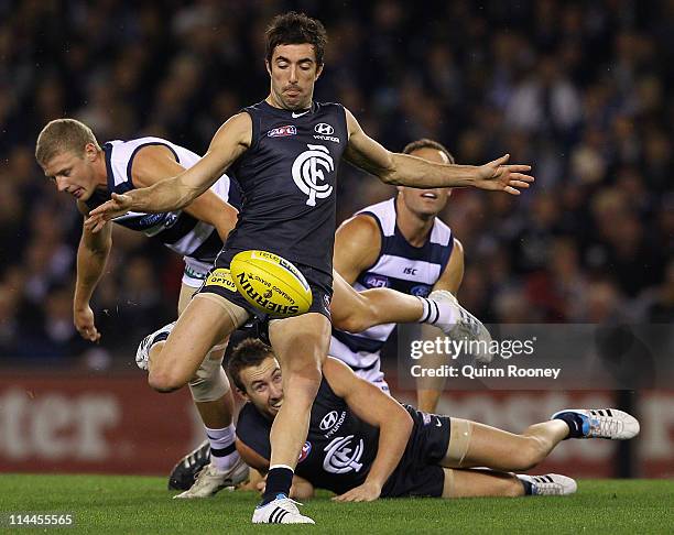Kade Simpson of the Blues kicks during the round nine AFL match between the Carlton Blues and the Geelong Cats at Etihad Stadium on May 20, 2011 in...