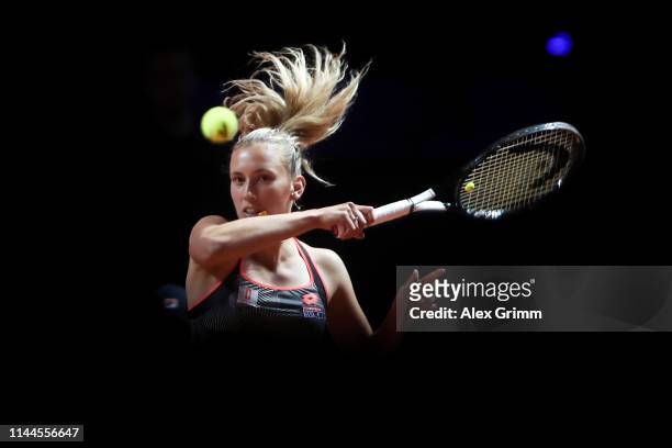 Elise Mertens of Belgium plays a forehand to Daria Kasatkina of Russia during their first round match on day 2 of the Porsche Tennis Grand Prix at...
