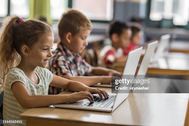 Kid Using Computer In Class 24,513 School Classroom Laptop Stock Photos, High-Res Pictures, and ...