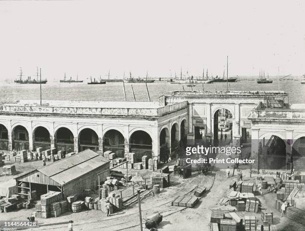 The Custom House, Veracruz, Mexico, 1895. Goods piled up at the Caribbean port of Veracruz. From "Round the World in Pictures and Photographs: From...