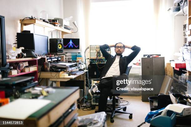 portrait of a contemplating electronic music producer - electronic music production stock pictures, royalty-free photos & images