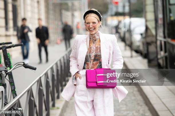 Digital Influencer Leonie Hanne wears Jennifer Behr headband, a Zimmermann suit and top, Roger Vivier bag and Dior sunglasses on February 28, 2019 in...