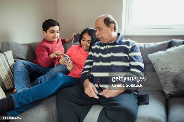 spending time with grandad - indian grandparents stock pictures, royalty-free photos & images