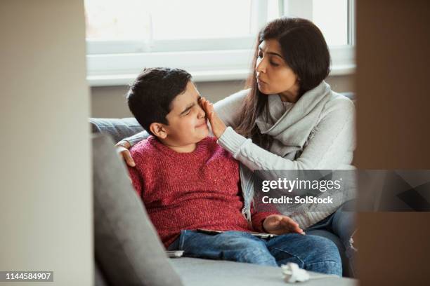 a caring mother - rubbing eyes stock pictures, royalty-free photos & images