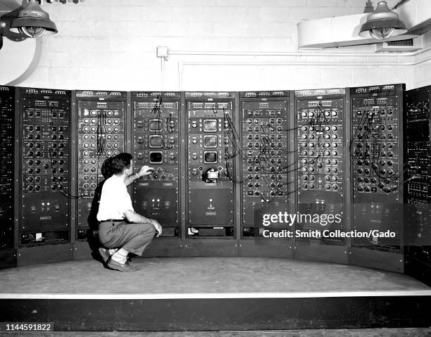 Engineer operating Analog Computing Machine in the Fuel Systems Building at the Lewis Flight Propulsion Laboratory, Cleveland, Ohio, September 28,...