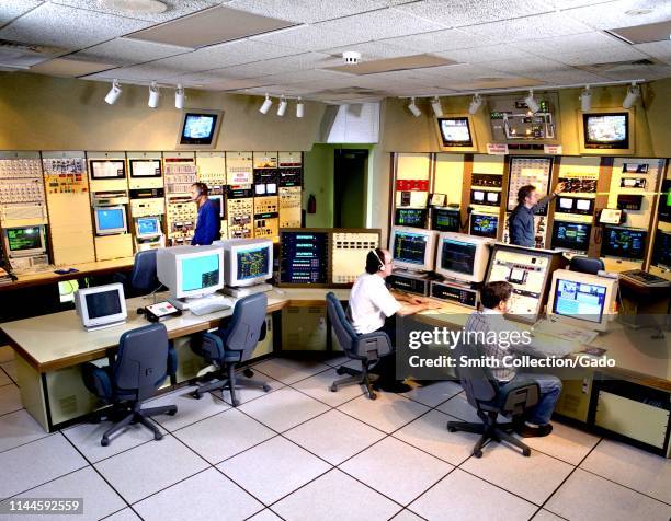 Engineers in control room at NASA John H Glenn Research Center at Lewis Field, Cleveland, Ohio, 1997. Image courtesy National Aeronautics and Space...