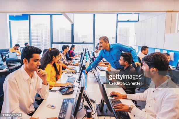 busy call centre in india - new business stock pictures, royalty-free photos & images