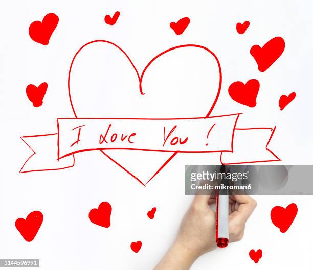 hand drawing a heart on white page with marker - love you stock pictures, royalty-free photos & images