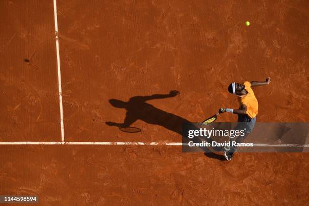 Frances Tiafoe of the United States serves against Juame Munar of Spain in their Mens round of 32 match during day two of the Barcelona Open Banc...