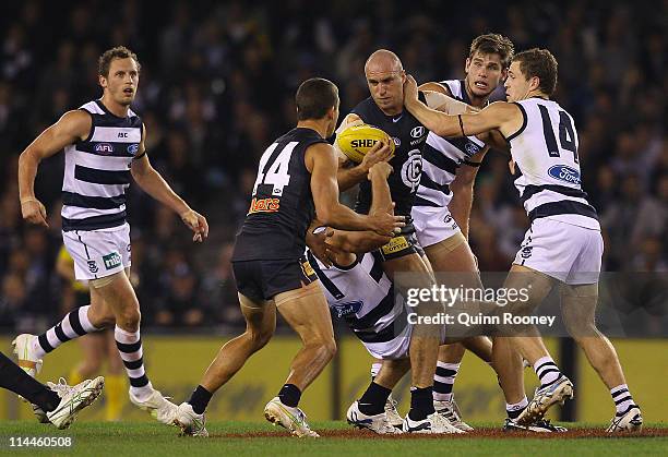 Chris Judd of the Blues is tackled during the round nine AFL match between the Carlton Blues and the Geelong Cats at Etihad Stadium on May 20, 2011...
