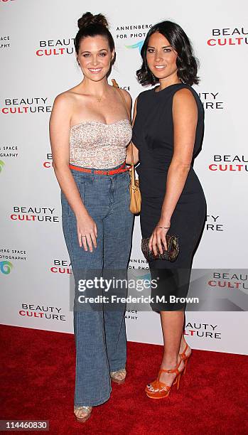 Actress Olivia Munn and her guest attend the Opening Night of "Beauty Culture" at The Annenberg Space For Photography on May 19, 2011 in Century...