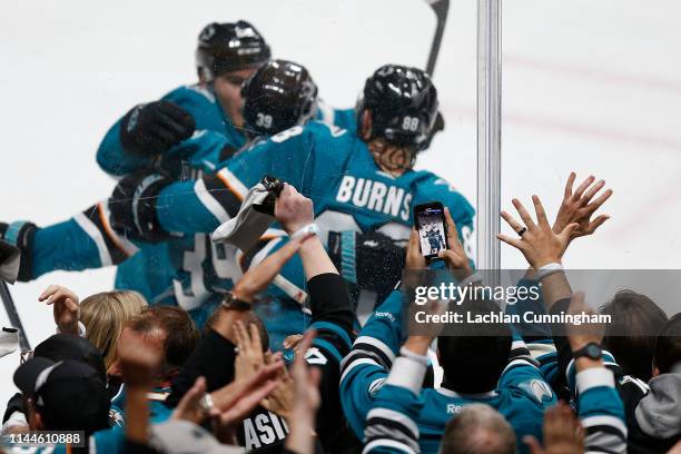 Fans celebrate and take photos after Logan Couture of the San Jose Sharks scored a goal against the Vegas Golden Knights in Game Five of the Western...