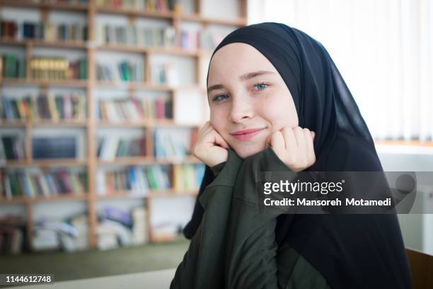 muslim girl in library - beautiful arabian girls stock pictures, royalty-free photos & images