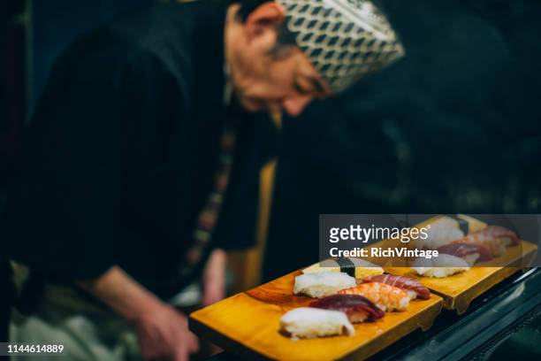 japanese chef preparing sushi - making sushi stock pictures, royalty-free photos & images