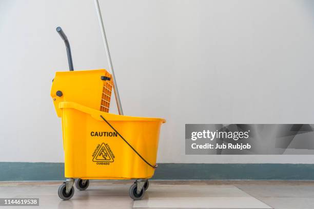 cleaning cart at the elevators - hospital cart stock pictures, royalty-free photos & images