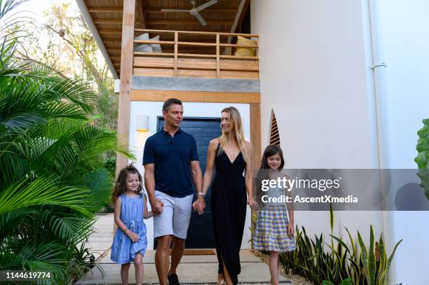 family enjoying a luxury vacation - wealthy family stock pictures, royalty-free photos & images