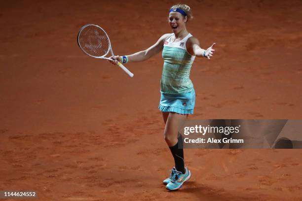 Laura Siegemund of Germany celebrates winning her first round match against Lesia Tsurenko of Ukraine on day 2 of the Porsche Tennis Grand Prix at...