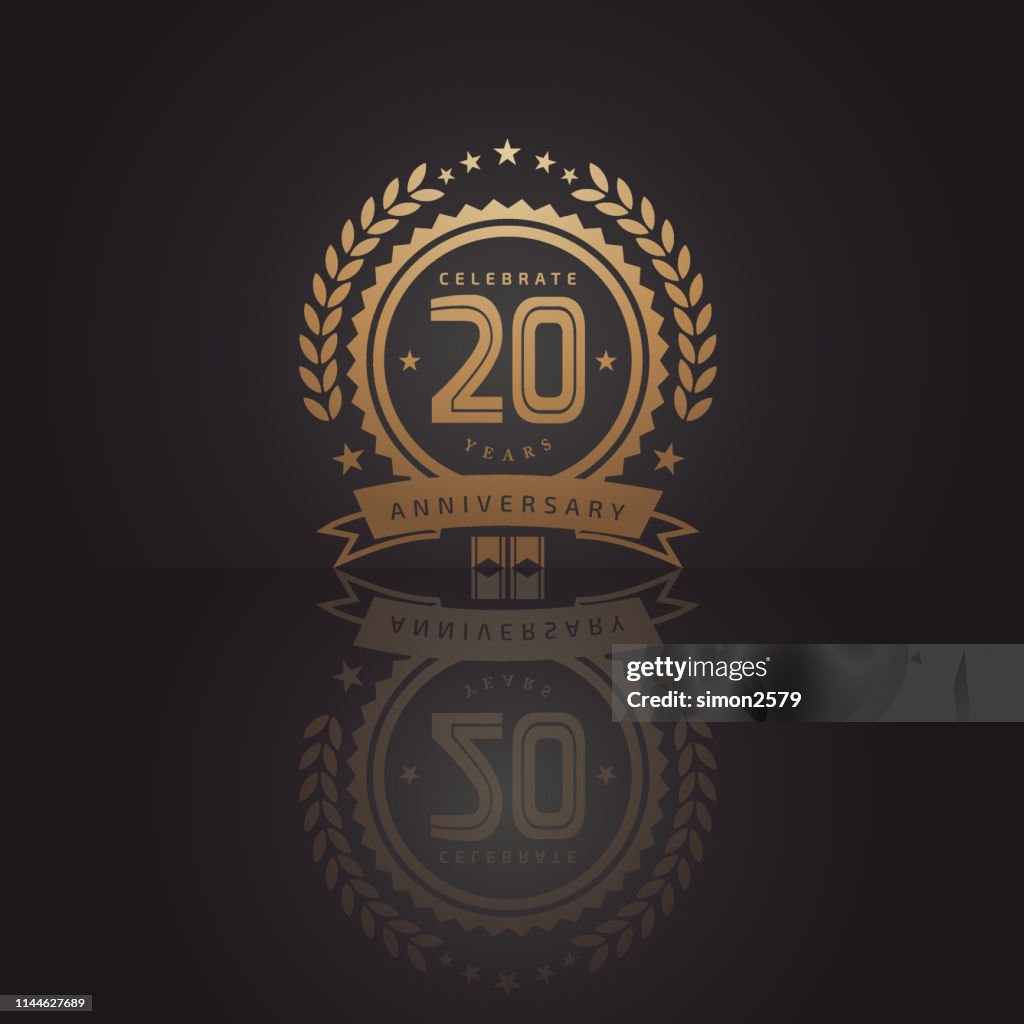 20 years golden anniversary icon with dark color background