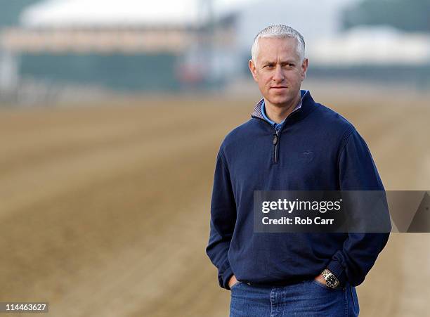 Trainer Todd Pletcher watches his Preakness horse Dance City go over the track at Pimlico Race Course on May 20, 2011 in Baltimore, Maryland. The...