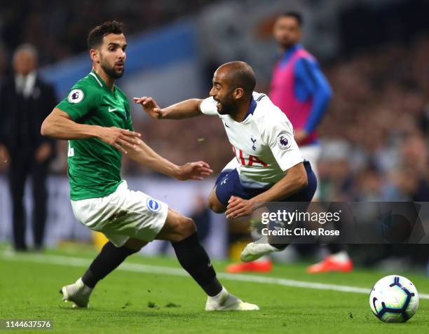 Lucas Moura of Tottenham Hotspur is challenged by Martin Montoya of Brighton and Hove Albion during the Premier League match between Tottenham...