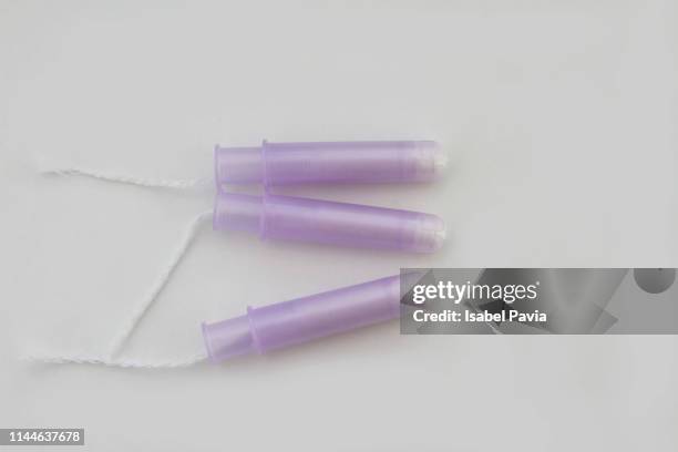 female tampons with disposable applicator - tampon stock pictures, royalty-free photos & images