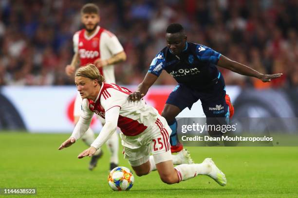 Mohammed Dauda of Vitesse tackles and fouls Kasper Dolberg of Ajax during the Eredivisie match between Ajax and Vitesse at Johan Cruyff Arena on...